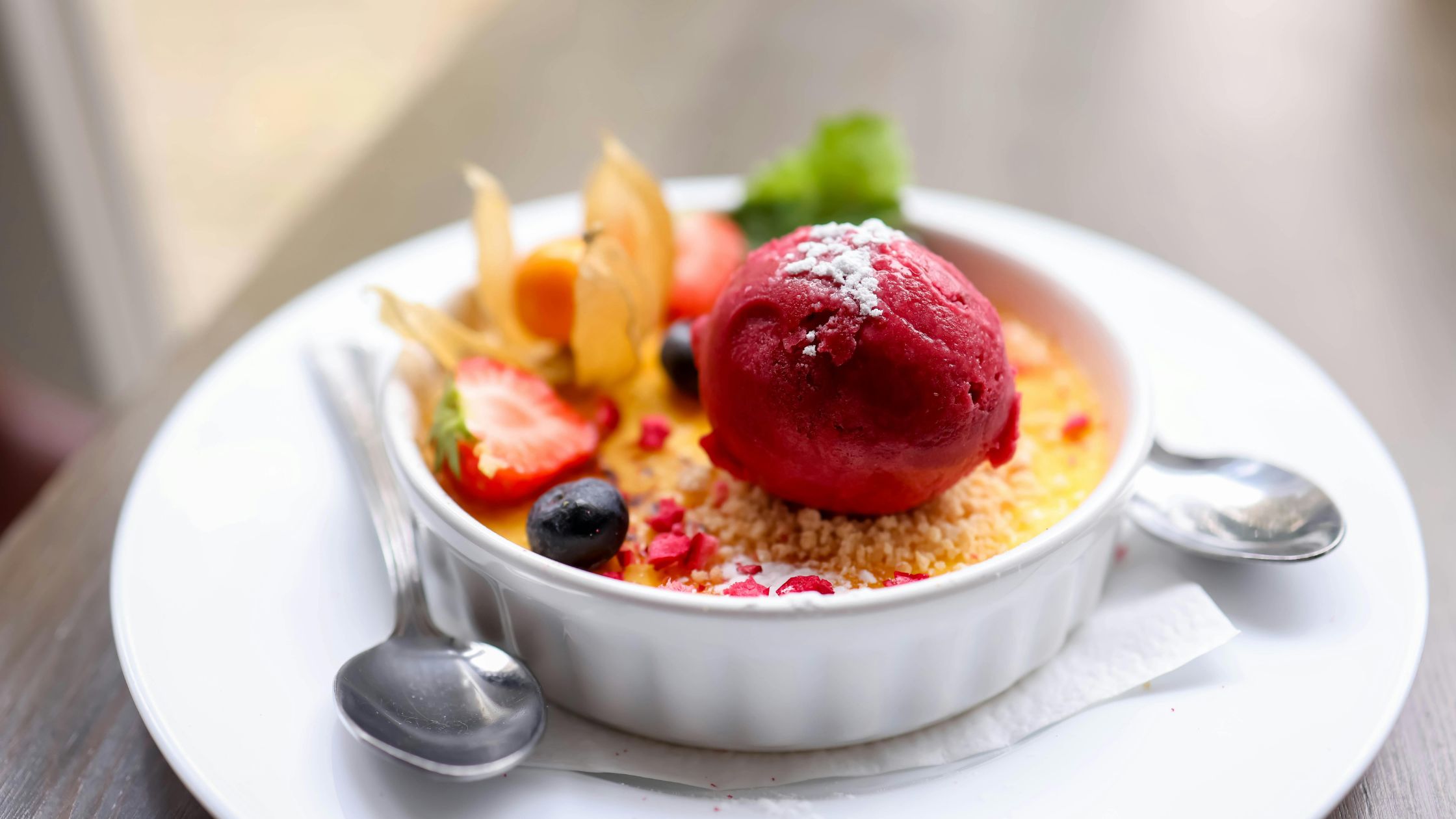 Crème Brûlée with strawberry sorbet